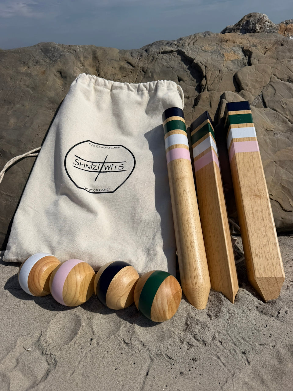 Shnizi Wits game set with carry bag, wooden stakes, and wits on rocks